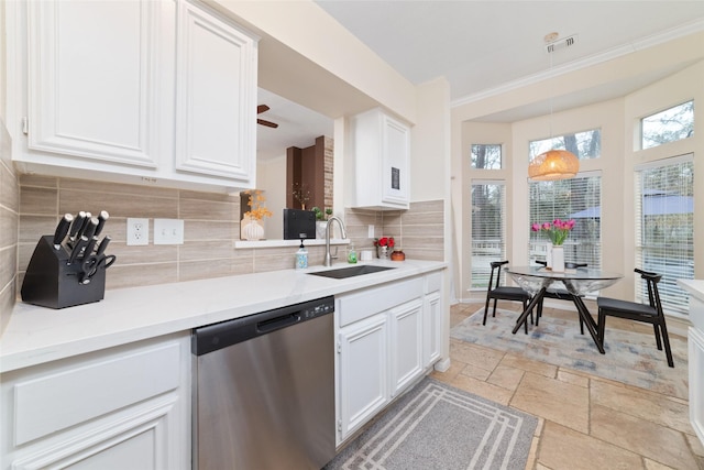 kitchen with stone tile floors, a sink, visible vents, white cabinets, and dishwasher