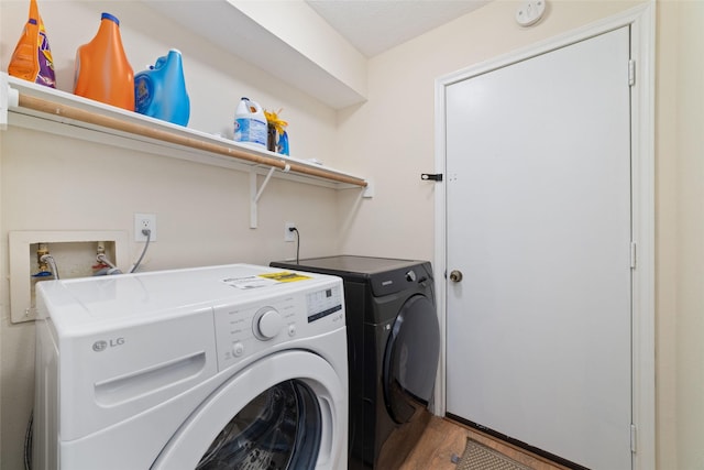 washroom with laundry area and washing machine and clothes dryer