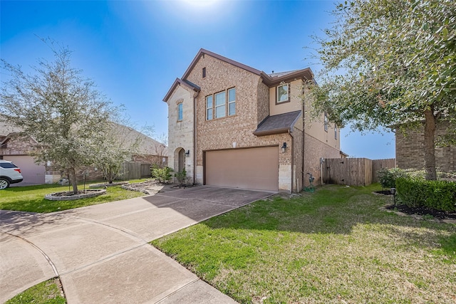 traditional-style home featuring a garage, brick siding, fence, driveway, and a front lawn