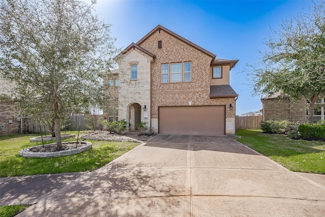 view of front of home featuring a front yard, fence, concrete driveway, and brick siding