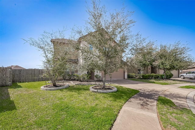 view of property hidden behind natural elements with a garage, a front yard, concrete driveway, and fence