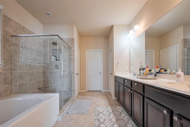 full bath with a stall shower, baseboards, a garden tub, tile patterned flooring, and vanity