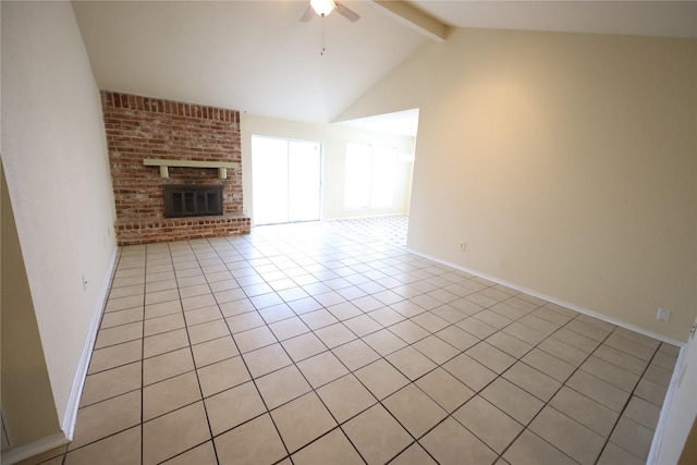 unfurnished living room featuring light tile patterned floors, baseboards, lofted ceiling with beams, ceiling fan, and a fireplace