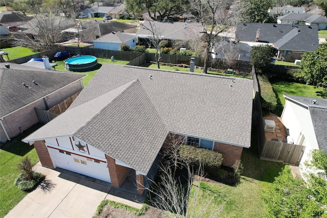 birds eye view of property with a residential view