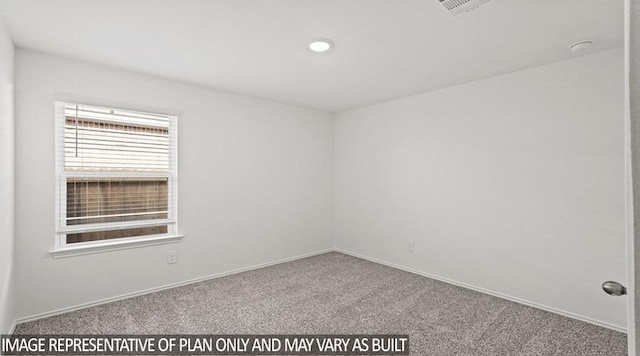 empty room featuring carpet flooring, visible vents, and baseboards