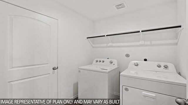 14615 Lost Cave Way, New Caney, TX 77357 - clothes washing area featuring independent washer and dryer, visible vents, and laundry area