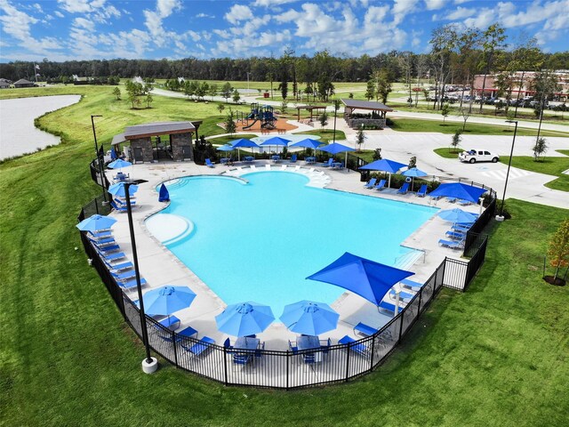 14615 Lost Cave Way, New Caney, TX 77357 - pool featuring a lawn and fence