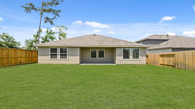 14615 Lost Cave Way, New Caney, TX 77357 - rear view of property featuring a patio area, a lawn, and a fenced backyard