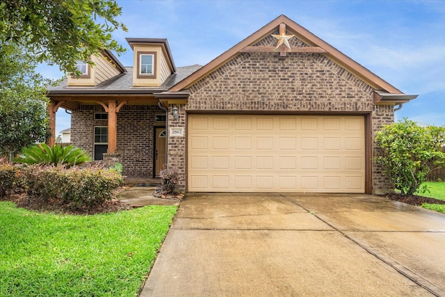 view of front of home with a garage, driveway, and brick siding