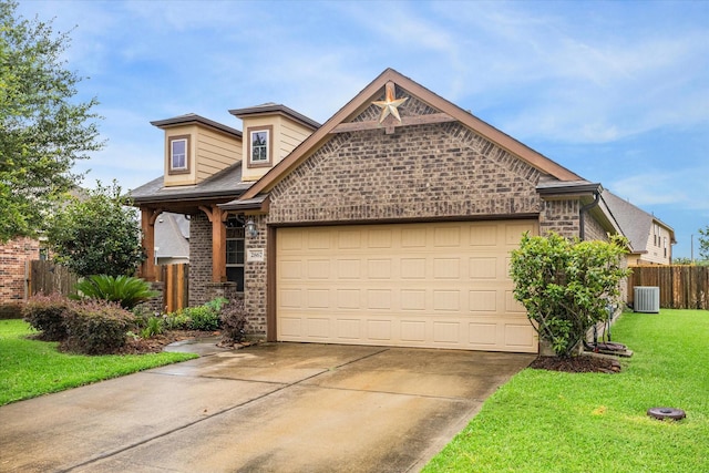 view of front of house featuring brick siding, concrete driveway, an attached garage, fence, and a front lawn