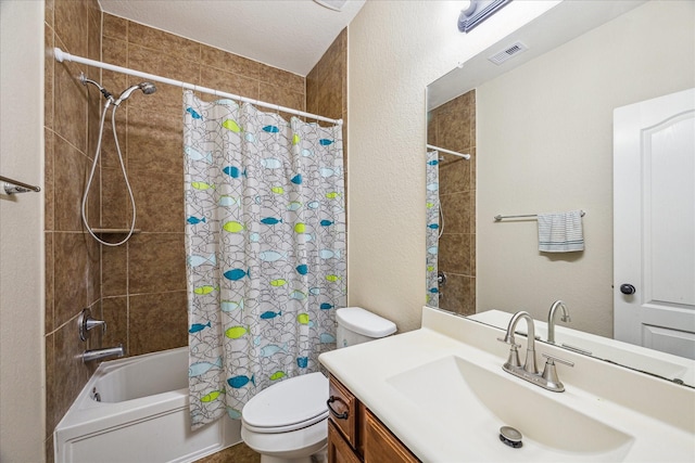 bathroom featuring a textured wall, toilet, vanity, visible vents, and shower / bath combo with shower curtain