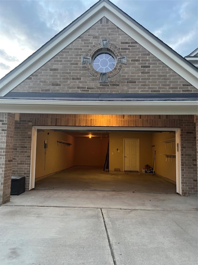 garage featuring driveway