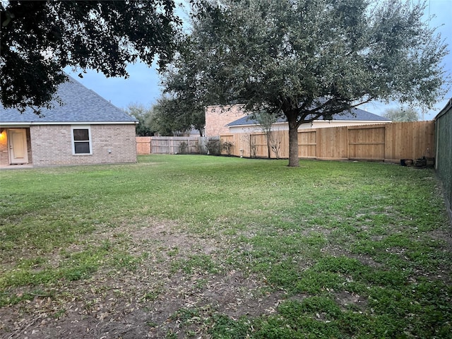 view of yard featuring a fenced backyard