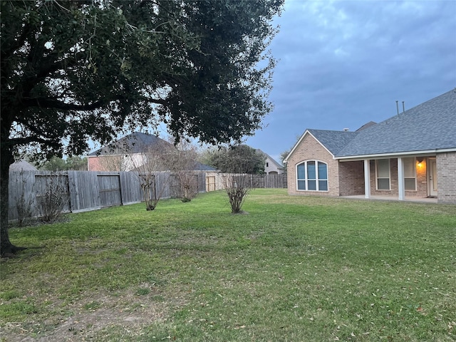 view of yard featuring a fenced backyard