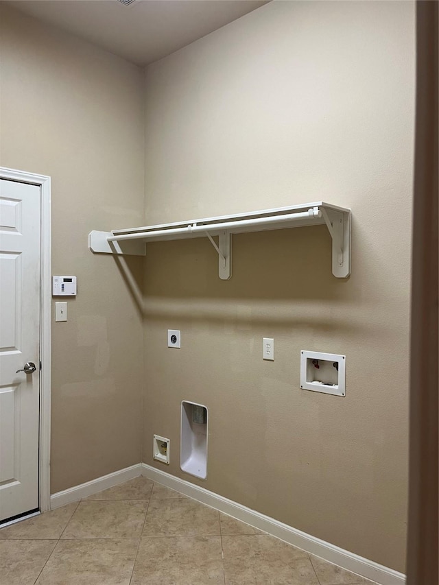 laundry area featuring light tile patterned flooring, laundry area, washer hookup, baseboards, and electric dryer hookup