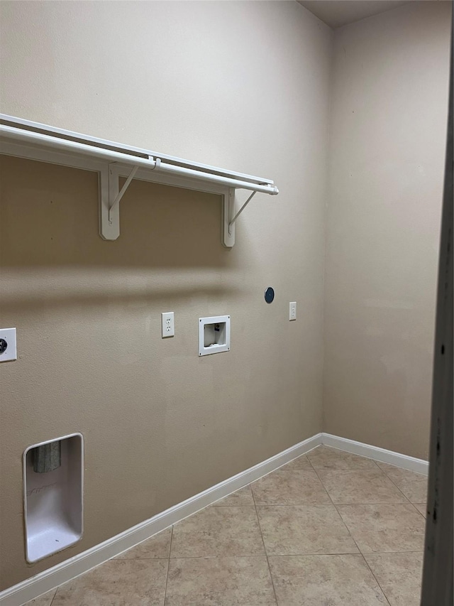 clothes washing area featuring light tile patterned floors, hookup for a washing machine, hookup for an electric dryer, laundry area, and baseboards