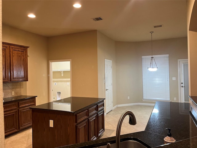 kitchen featuring dark countertops, visible vents, and recessed lighting