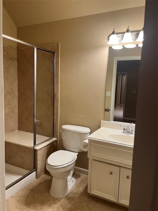 full bath featuring toilet, a shower stall, tile patterned flooring, and vanity