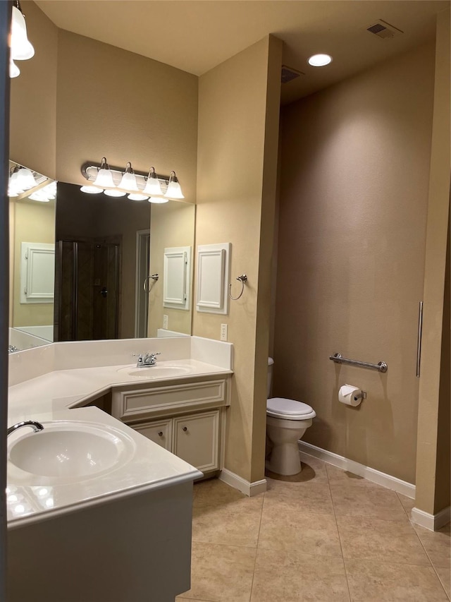 bathroom with visible vents, baseboards, toilet, tile patterned flooring, and vanity