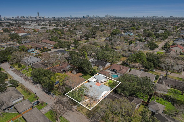 birds eye view of property featuring a city view