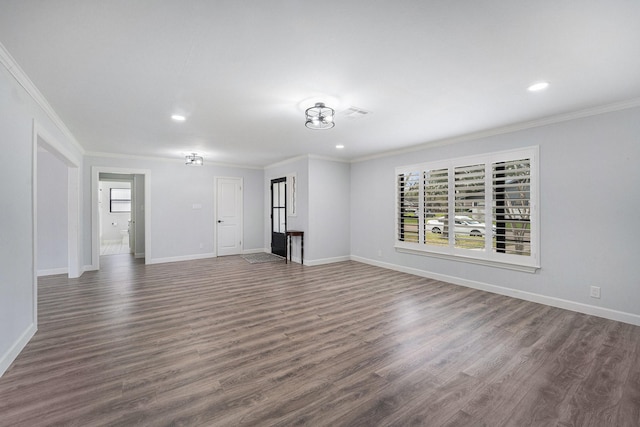 unfurnished living room featuring crown molding, baseboards, and dark wood-type flooring