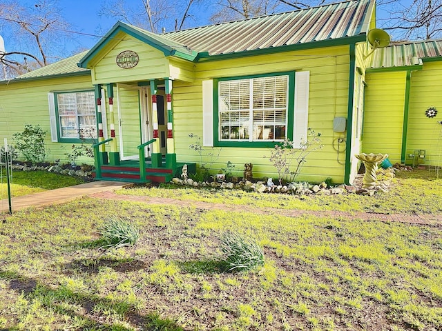 bungalow-style home with metal roof