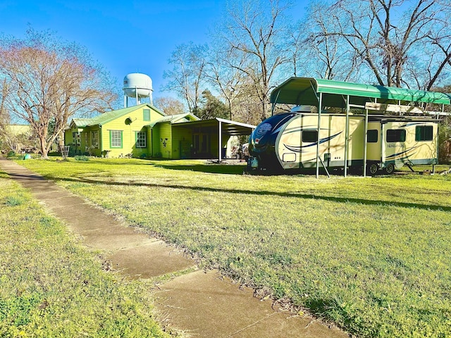 view of yard with a detached carport