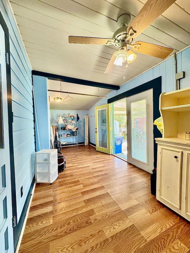 interior space featuring lofted ceiling and ceiling fan