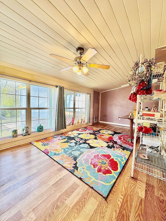 interior space featuring wooden ceiling and a ceiling fan