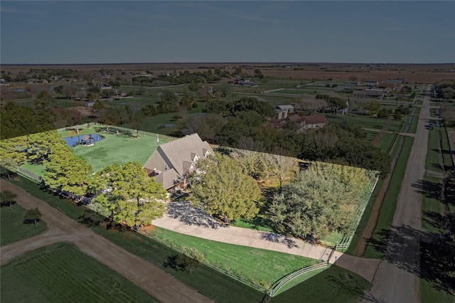 birds eye view of property with a rural view