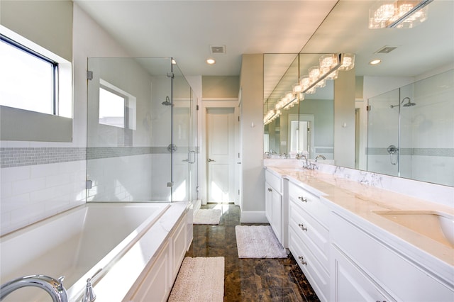 full bath featuring a stall shower, visible vents, and double vanity