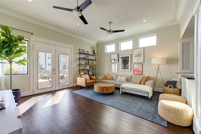 living area with crown molding, wood finished floors, and french doors