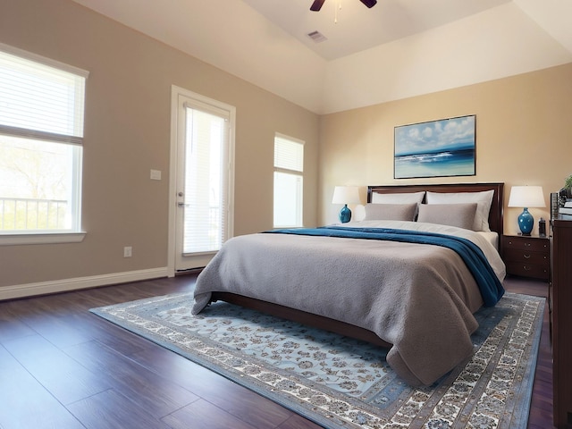 bedroom with visible vents, wood finished floors, baseboards, and ceiling fan