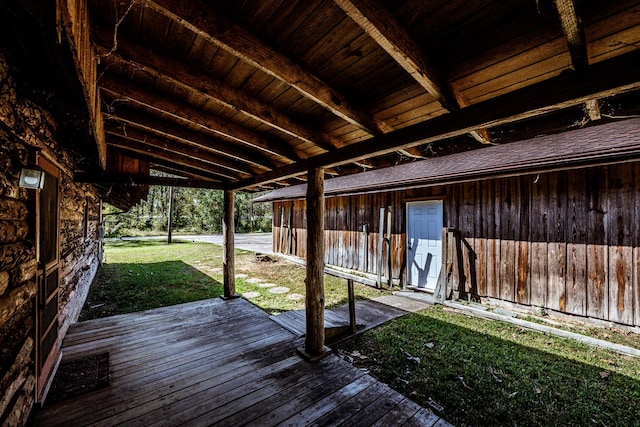 wooden deck with a lawn