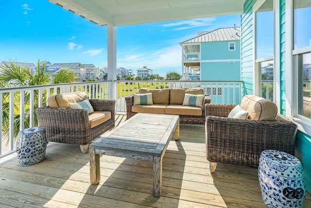 balcony with outdoor lounge area and a sunroom