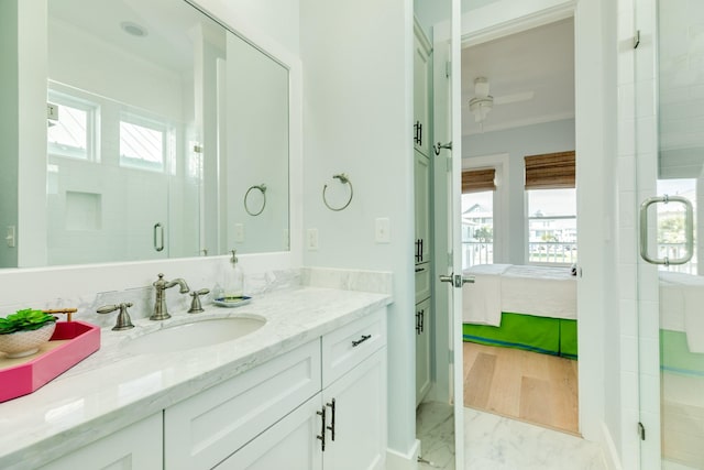 full bath featuring ensuite bathroom, a stall shower, and vanity