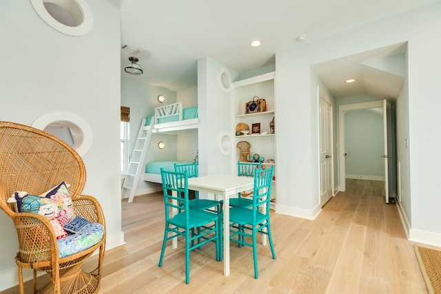 recreation room featuring light wood-style floors, recessed lighting, visible vents, and baseboards