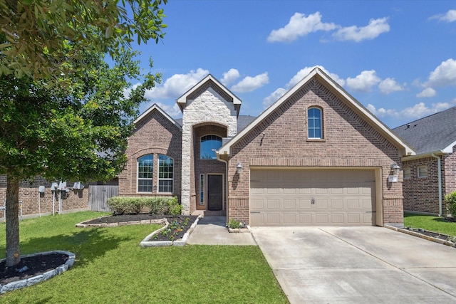 view of front of house with brick siding, a front lawn, fence, concrete driveway, and a garage