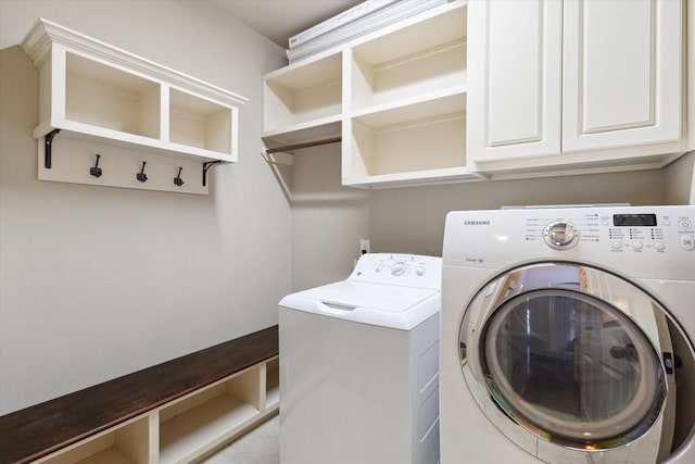 laundry area featuring cabinet space and washing machine and dryer