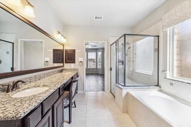 full bathroom featuring a sink, visible vents, a shower stall, and tile patterned floors