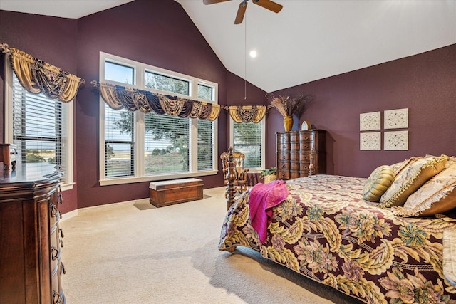 bedroom with high vaulted ceiling, multiple windows, carpet, and a ceiling fan