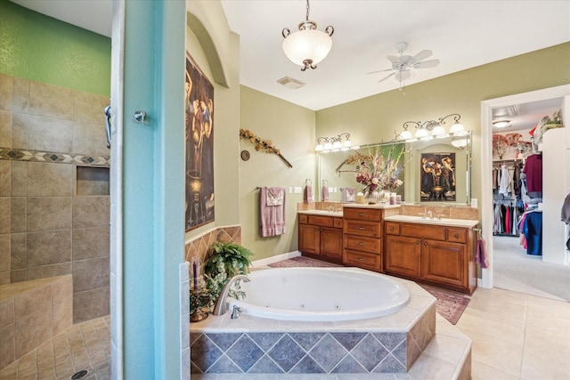 full bath with a tub with jets, visible vents, a sink, and tiled shower