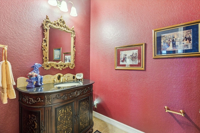 bathroom featuring tile patterned floors, vanity, and baseboards