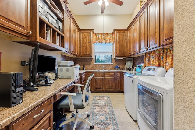 interior space featuring light tile patterned floors, built in study area, a sink, ceiling fan, and independent washer and dryer