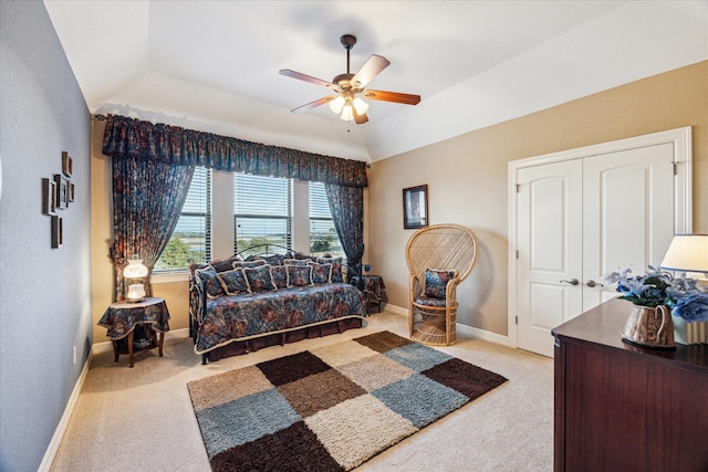 living area with carpet floors, vaulted ceiling, ceiling fan, and baseboards