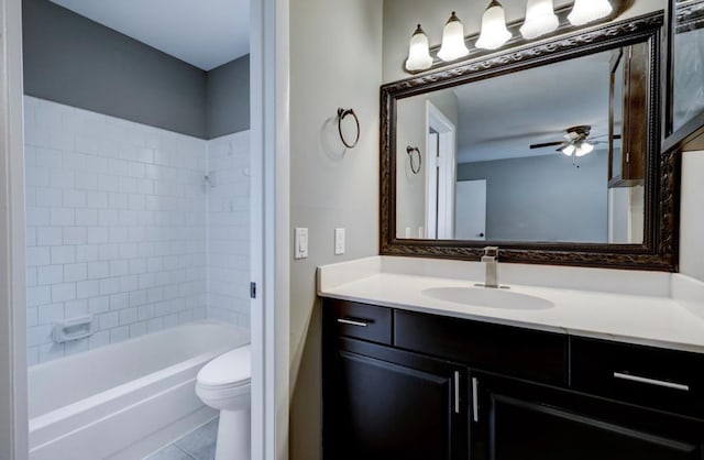 bathroom with vanity, a ceiling fan, tile patterned flooring, shower / tub combination, and toilet