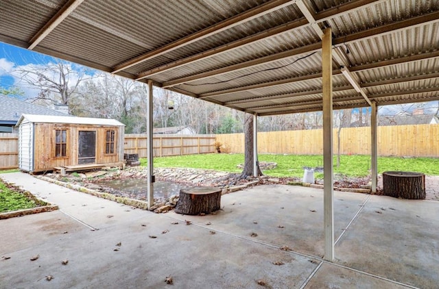 view of patio / terrace featuring a fenced backyard and an outdoor structure