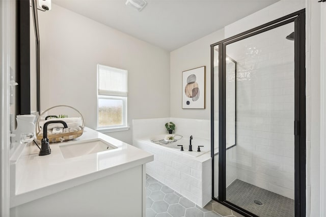 18823 Cypress Meadow Ct, Magnolia, TX 77355 - bathroom featuring vanity, a garden tub, a shower stall, and tile patterned floors