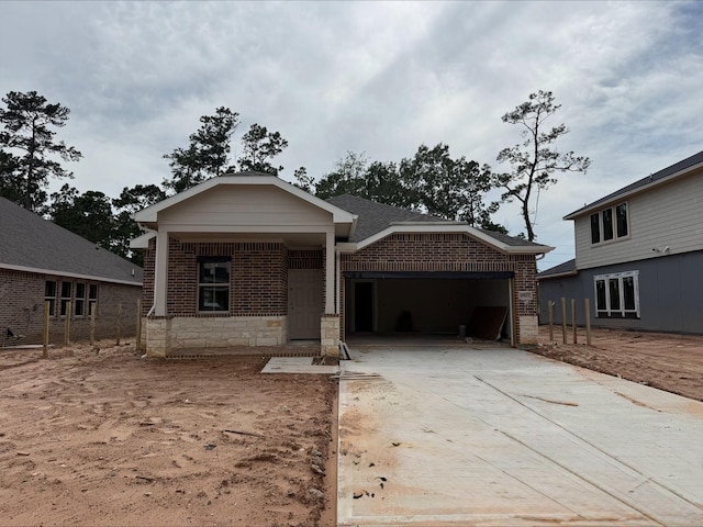 18823 Cypress Meadow Ct, Magnolia, TX 77355 - view of front facade with brick siding, an attached garage, and driveway