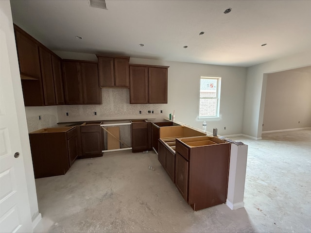 18823 Cypress Meadow Ct, Magnolia, TX 77355 - kitchen with tasteful backsplash and unfinished concrete flooring